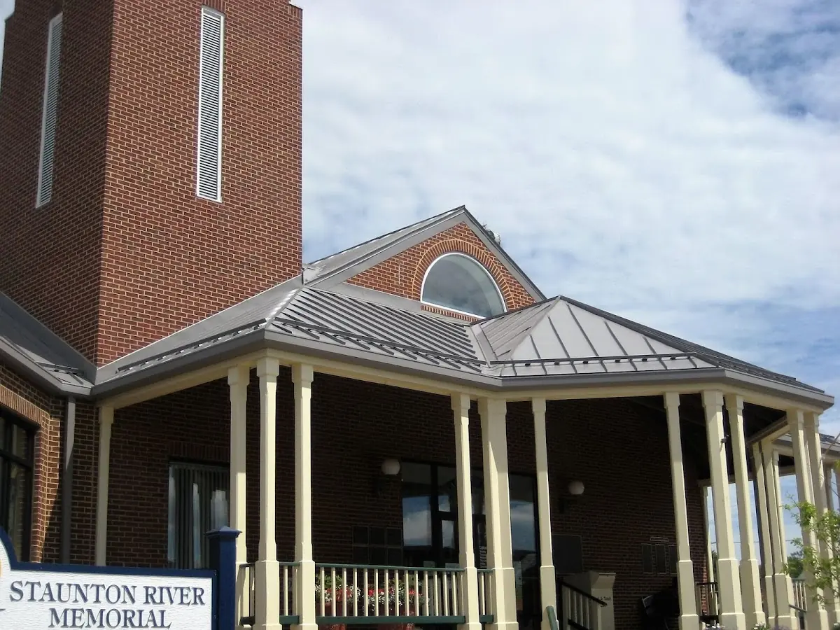 Skilled roofing craftsmen working on a residential roof in Fairhaven